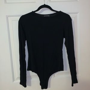 PRETTY LITTLE THING. Black long sleeve bodysuit.